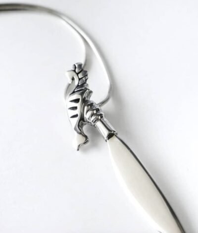 Detailed close-up of Barong pendant – artisan silver jewelry echoing Filipino warrior symbolism.