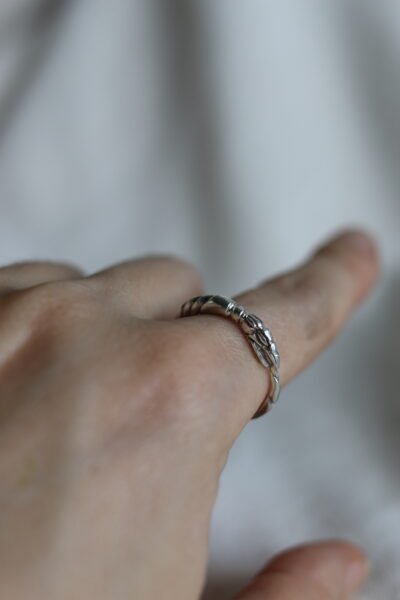 A handmade silver Ouroboros snake ring symbolizing eternity, featuring a mythological snake design. Perfect as a stacking ring or a unique ancient symbol jewelry gift