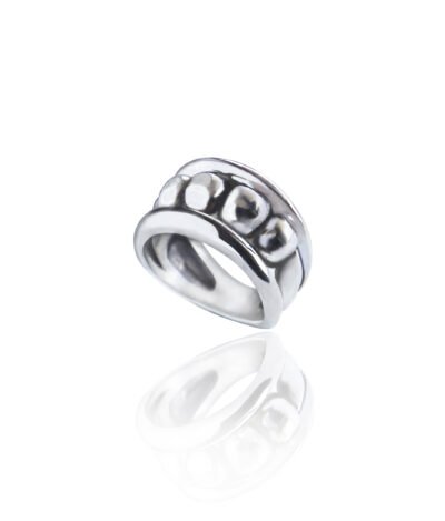 Silver ring inspired by ancient Greek Ionic columns, featuring a bold design with a dark aesthetic